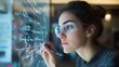 © fotofabrika - Young woman writing equations on glass surface in a modern laboratory during the day