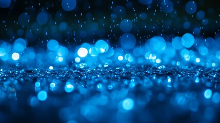 Wall Mural - Abstract blue bokeh lights on dark background.