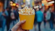 © ArtCookStudio - Enjoying fresh popcorn while walking through a busy outdoor market in autumn