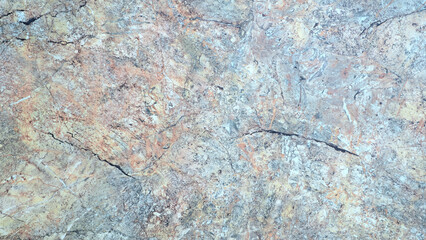 Aufkleber - A grey and brown stone wall with a few cracks. The wall is made of stone and has a rough texture