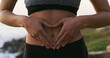 © peopleimages.com - Woman, hands and balance with stomach for gut health, fitness or belly wellness in nature. Closeup, female person or tummy with good digestion for healthcare, training or workout by beach or ocean