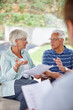 © peopleimages.com - Elderly couple, discussion and documents with financial advisor for retirement plan, pension fund or decision at home. Senior, man or woman with paperwork or consultant for retired annuity or options