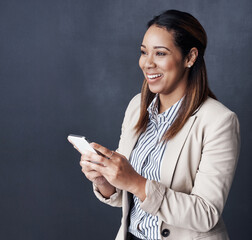 Poster - Business woman, phone and happy in studio with texting, reading and mockup space by grey background. Person, smartphone and excited with mobile app for good news on web, networking and social media