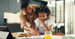 © peopleimages.com - Home, mother and helping kid with homework for learning support, child development and growth in education. Lunch, woman and girl with books at dining table for language study, project or school task
