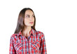 © peshkova - Woman wearing a red plaid shirt, looking to the side on a clean white background. Isolated concept for fashion, design, or advertisement
