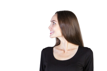 Poster - A young woman with long brown hair smiling in profile view, wearing atop, isolated on a clean white background. Concept of happiness