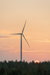 Wall Mural - A windmill and the rising sun on an autumn morning. Northern Finland