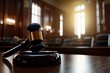 © Babb - A gavel sits on a wooden table in a courtroom