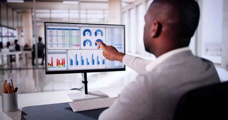 Poster - African American Man Analyzing Financial Data On Computer Screen