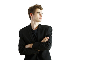 Poster - Young man wearing ablazer with arms crossed, looking confidently to the side. Isolated on a white background. Concept of professional attitude