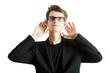 © peshkova - Young man wearing glasses, suit, holding both hands near ears, standing against a white background. Concept of listening or attention