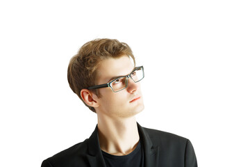 Poster - Portrait of a young man wearing glasses and ablazer, looking thoughtfully upward. Isolated on a white background. Concept of thinking