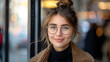 © amixstudio - Smiling Woman with Glasses in Urban Setting