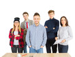 © peshkova - A group of young professionals standing together, smiling confidently near a table. Isolated on a white background. Concept of teamwork and collaboration