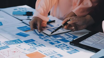 Wall Mural - close up ux developer and ui designer brainstorming about mobile app interface wireframe design on t