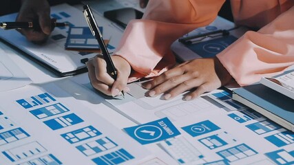 Wall Mural - close up ux developer and ui designer brainstorming about mobile app interface wireframe design on t