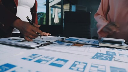 Wall Mural - close up ux developer and ui designer brainstorming about mobile app interface wireframe design on t
