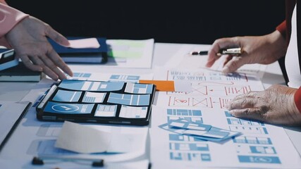 Wall Mural - close up ux developer and ui designer brainstorming about mobile app interface wireframe design on t