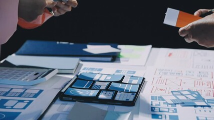 Wall Mural - close up ux developer and ui designer brainstorming about mobile app interface wireframe design on t