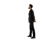 © peshkova - A man in a formalsuit standing in profile, hands clasped behind his back, on a white background. Business concept