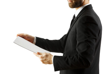 Poster - Closeup of a man wearing a formal suit holding a blank sheet of paper. Isolated on a white background. Concept of business and presentation