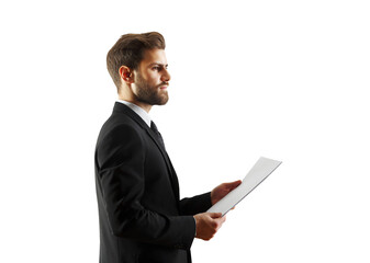 Poster - Professional businessman wearing a suit holding a document in hands, isolated on a clean white background, concept of business professionalism
