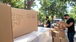 © Narongsag - Efficient E commerce Delivery  Workers Loading Cardboard Boxes onto Truck