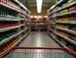 © claudunia - Supermarket shopping cart with blurred background of shelves.