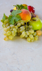 Wall Mural - Grapes and various autumn fruits on the table