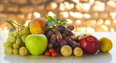 Wall Mural - Grapes and various autumn fruits on the table