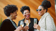© Colors of Earth Co. - Stylish mature African American women enjoying champagne at elegant party, fashionable older ethnic black friends celebrating in style at fancy gathering