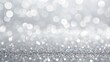 © Ast - Abstract silver bokeh lights with soft glowing gradient background.