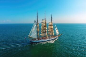 Wall Mural - a sailboat gliding through the open ocean, blue waters and white foam