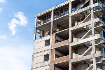 Wall Mural - Modern Building Under Construction with Clear Blue Sky