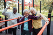 © Marko Geber - Senior friends taking a selfie after a group workout at an outdoor park