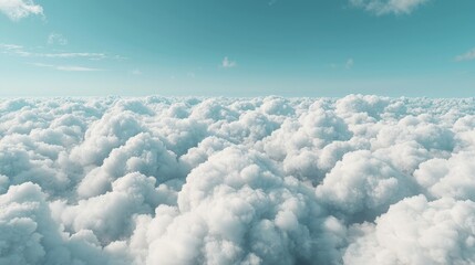 Wall Mural - Aerial view of fluffy white cumulus cloudscape under a blue sky.