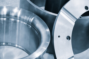 Poster - A metal piece with a hole in the middle. The hole is surrounded by a metal ring