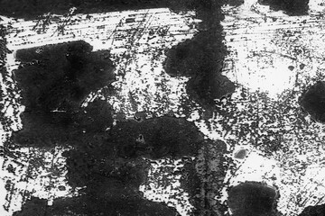 Poster - A black and white photo of a wall with a lot of scratches and marks. The wall is covered in black paint and white paint