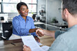 © insta_photos - Happy African American business woman getting job handshaking bank manager at office meeting. Male hr hiring recruit at job interview, insurance agent, lawyer making contract deal with client at work.