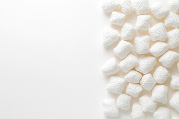 White marshmallows on right with ample copy space on left.