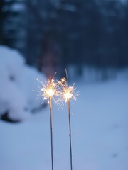 Two burning sparklers in the snow holiday