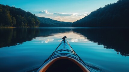 Wall Mural - Kayaking on a serene lake surrounded by lush mountains during sunset hours