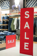 Signs announcing the start of sales in the store, sale signs in front of the store, discounts up to 50 percent, ideas for buying products during the end of the year sale