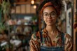 © S photographer - A confident woman wearing glasses and a headband in a cozy shop environment.