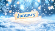 © StellaPattaya - January calligraphy inscription with winter snow and snowflakes blurred background Jan month