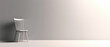 © Alex - 3D render of an empty white chair facing a blank wall