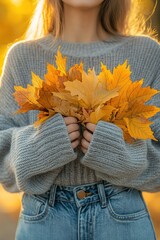 Wall Mural - Model woman with autumn leaves in autumn park