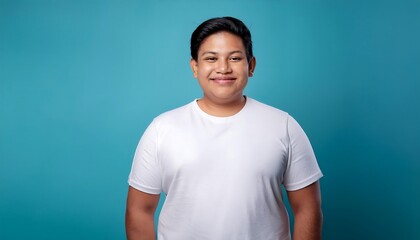 joyful young hispanic plus size body positive male man boy guy 30s in white blank design casual t-shirt posing color background studio portrait