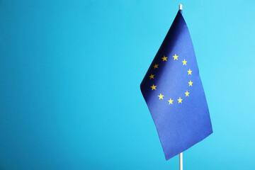 Wall Mural - One flag of European Union on light blue background. Space for text