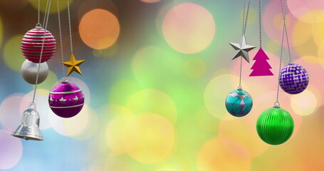 Wall Mural - image of christmas baubles, stars and bell over christmas fairy light background